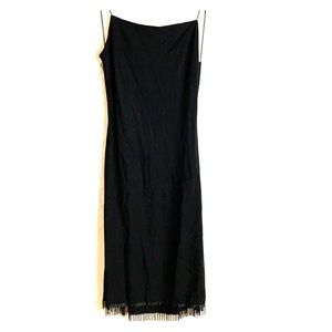 Backless dress with beaded fringe hemline.